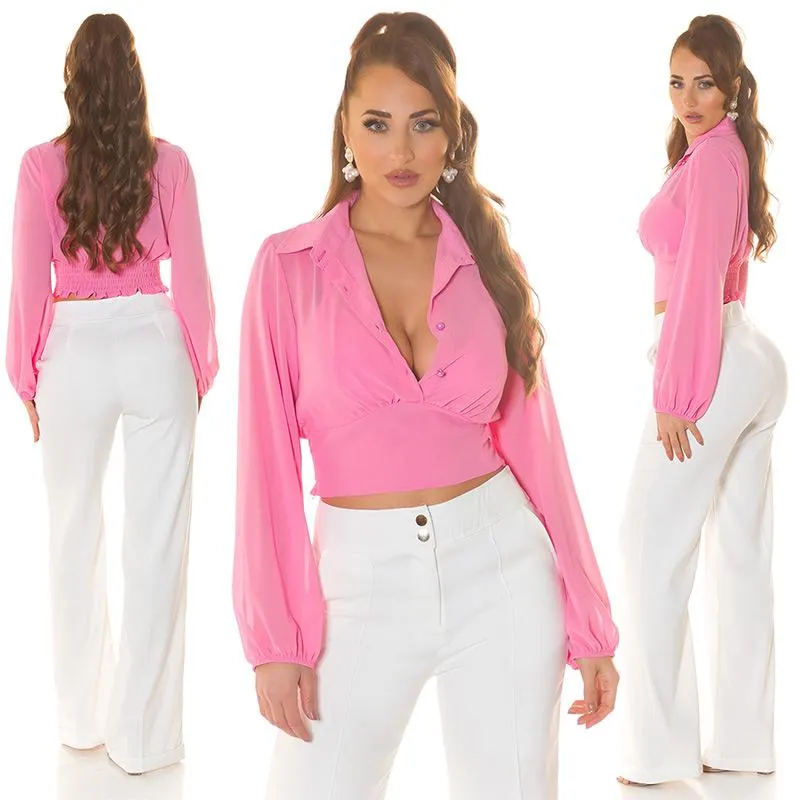 Blusa rosa con manga larga amplias