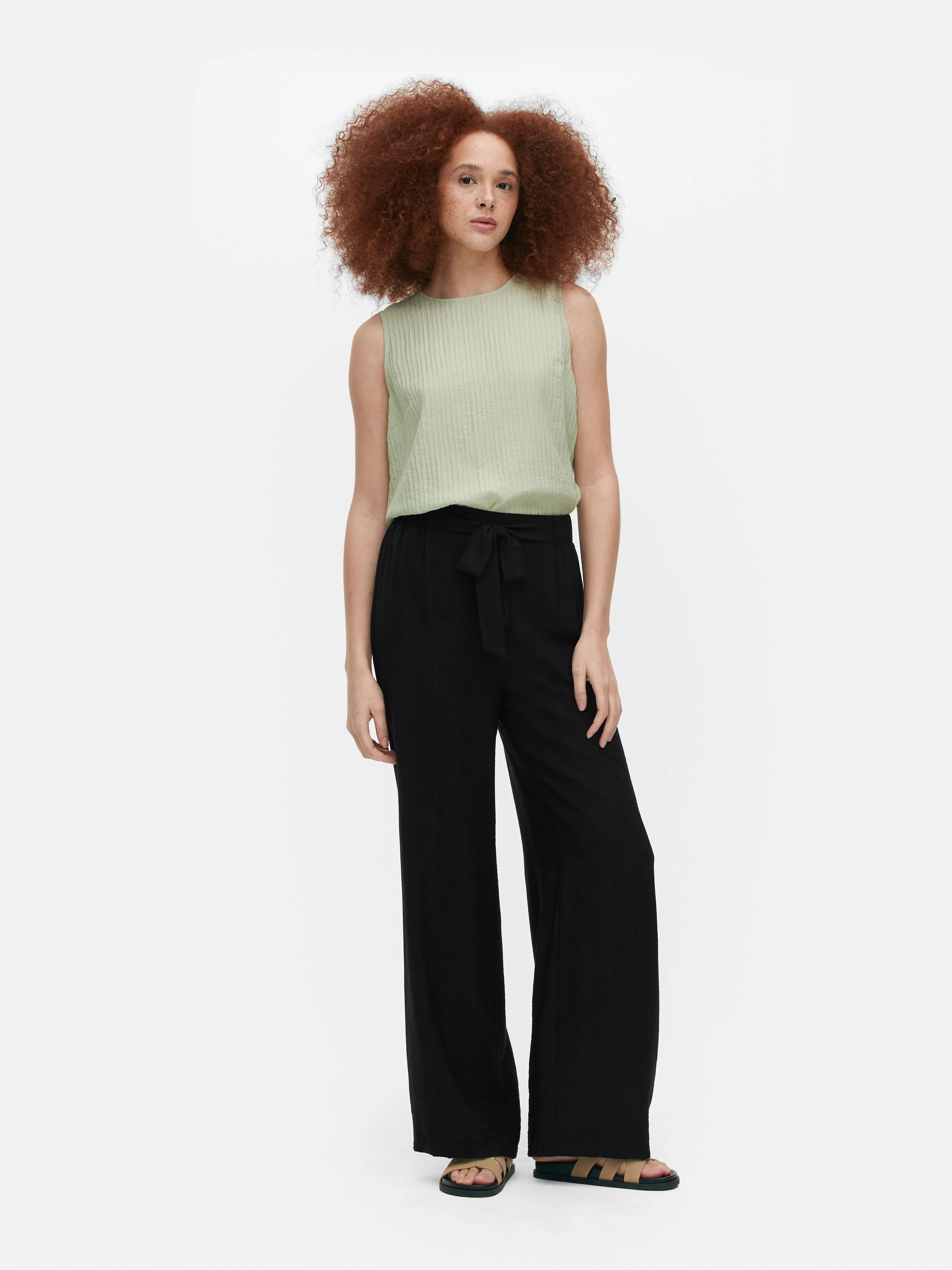 Pantalón palazzo con nudo delantero