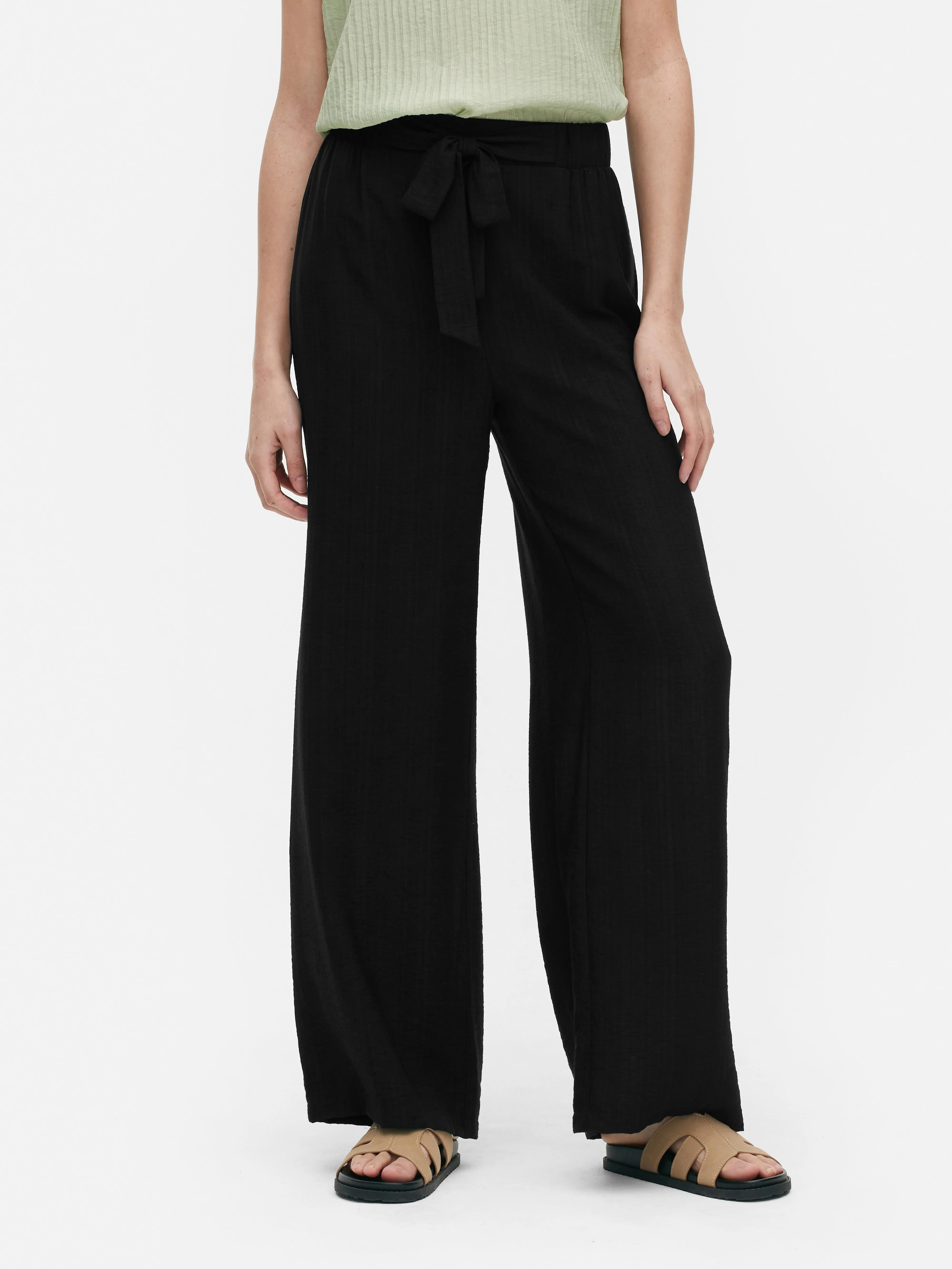 Pantalón palazzo con nudo delantero