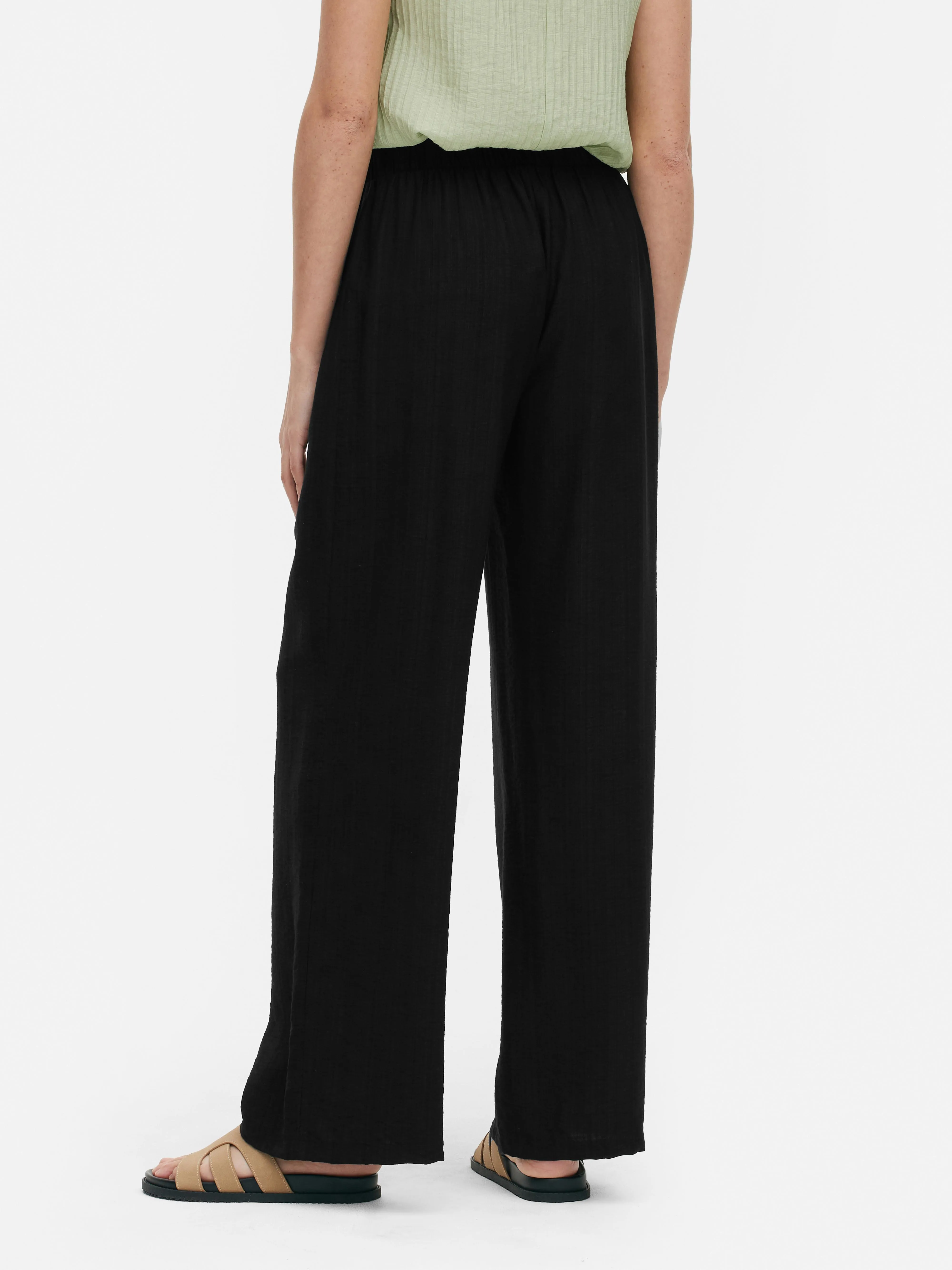 Pantalón palazzo con nudo delantero